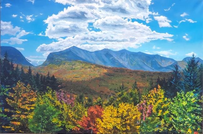 A White Mountains vista with a cloud bank over the ridge and brilliant fall foliage in the valley