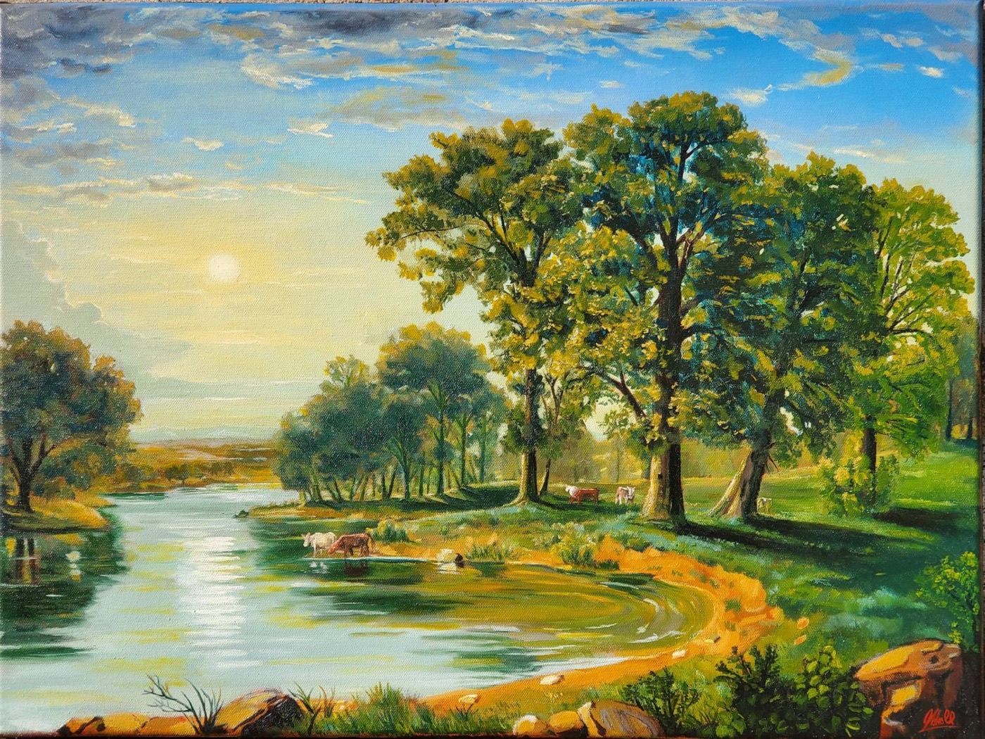 Cattle watering at a river bend beneath oak trees in evening light